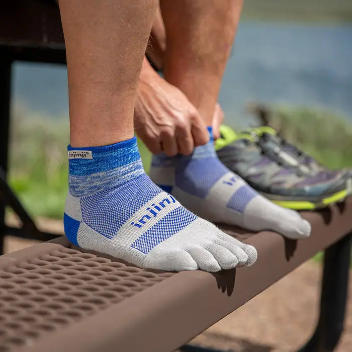 Injinji Trail Midweight Mini Crew Mens Neptune man stood on bench