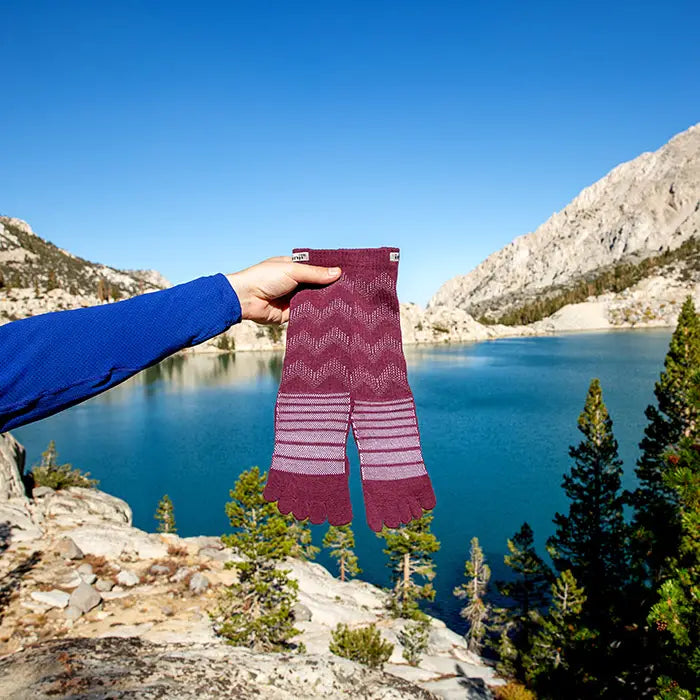 Injinji Outdoor Midweight Crew Mens Garnet man holding with mountain lake background