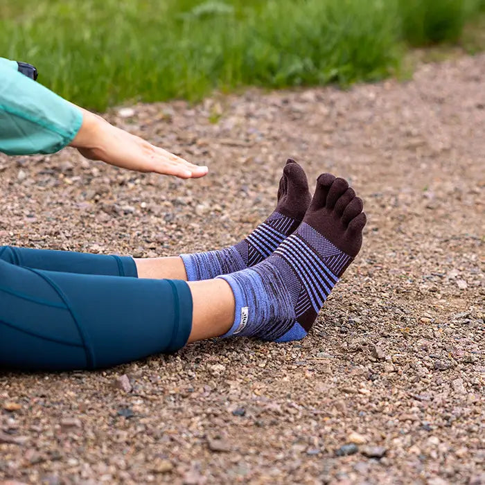Injinji Trail Midweight Mini Crew Womens Granite Periwinkle model wearing and stretching