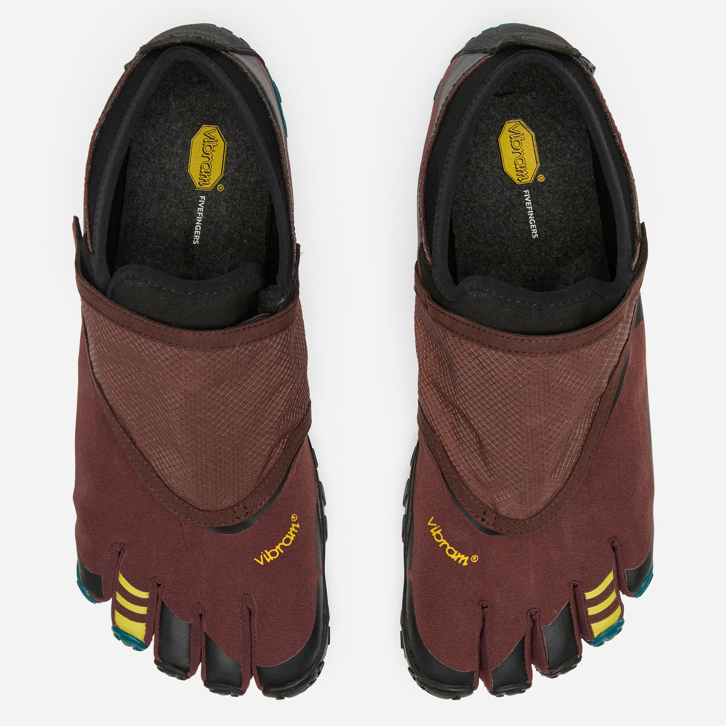 A pair of Vibram toe-loop shoes shown from a top-down view on a light gray background. The shoes feature a dark reddish-brown textile upper, black midfoot and toe sections, and small yellow accents on the toes.