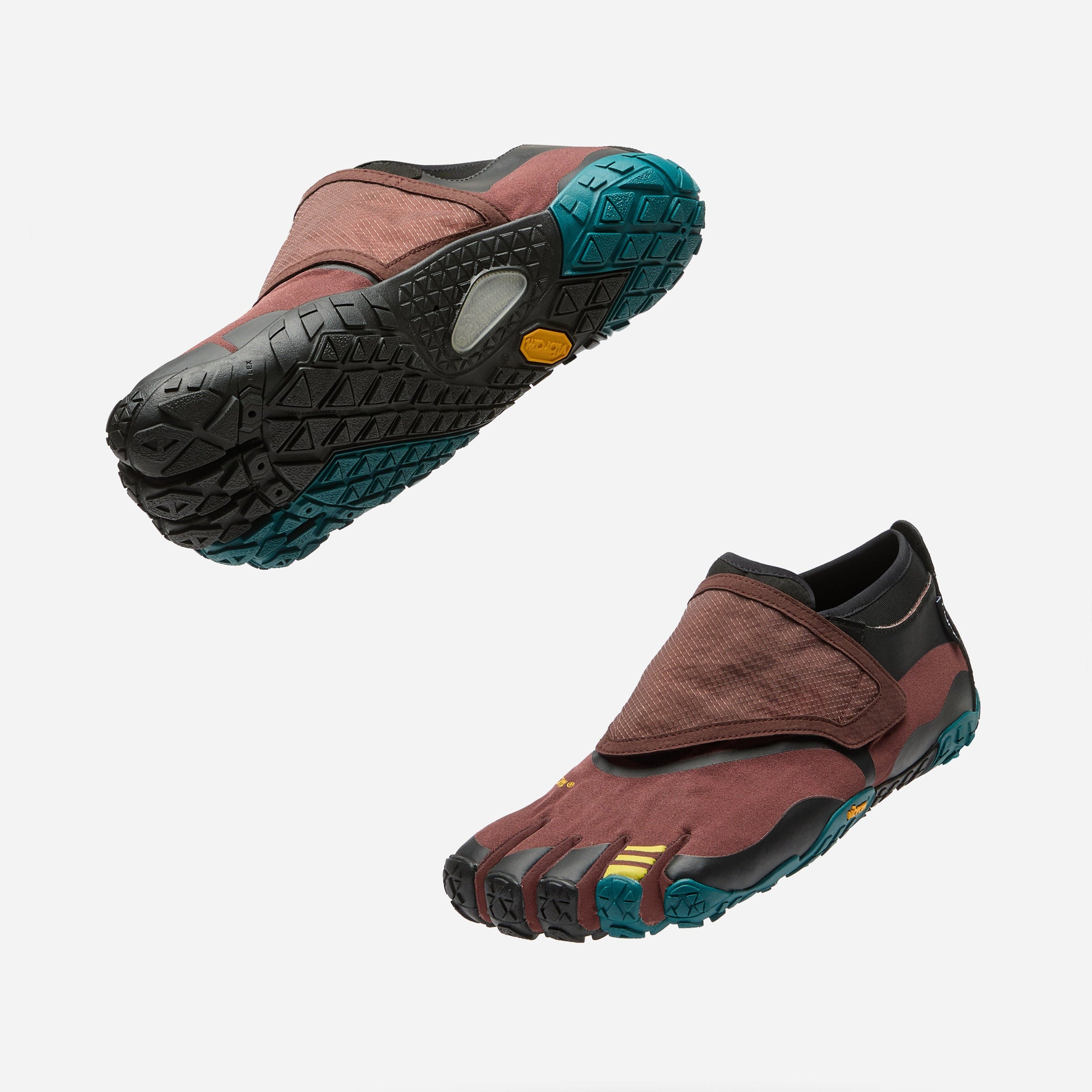 Two Vibram freebooter minimalist shoes shown from different angles against a light gray background. The shoes feature a burgundy upper, black toe caps, and a teal and black outsole with a small yellow Vibram logo.