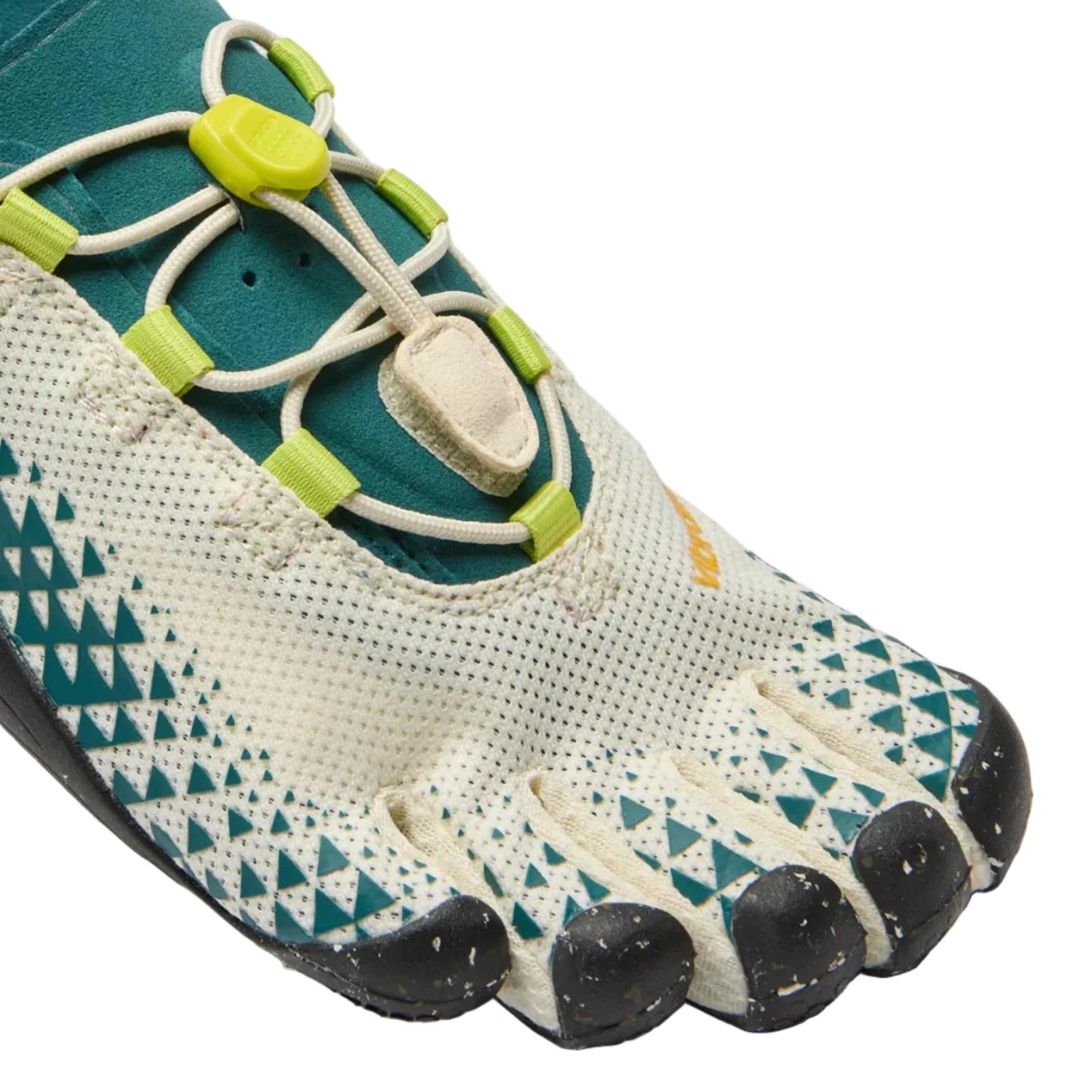 A close-up of a minimalist toe shoe on a light gray background. The shoe features a cream-colored knit upper with teal geometric patterns, dark teal footbed lining, and black toe caps, secured with cream laces and lime green adjustment sliders.