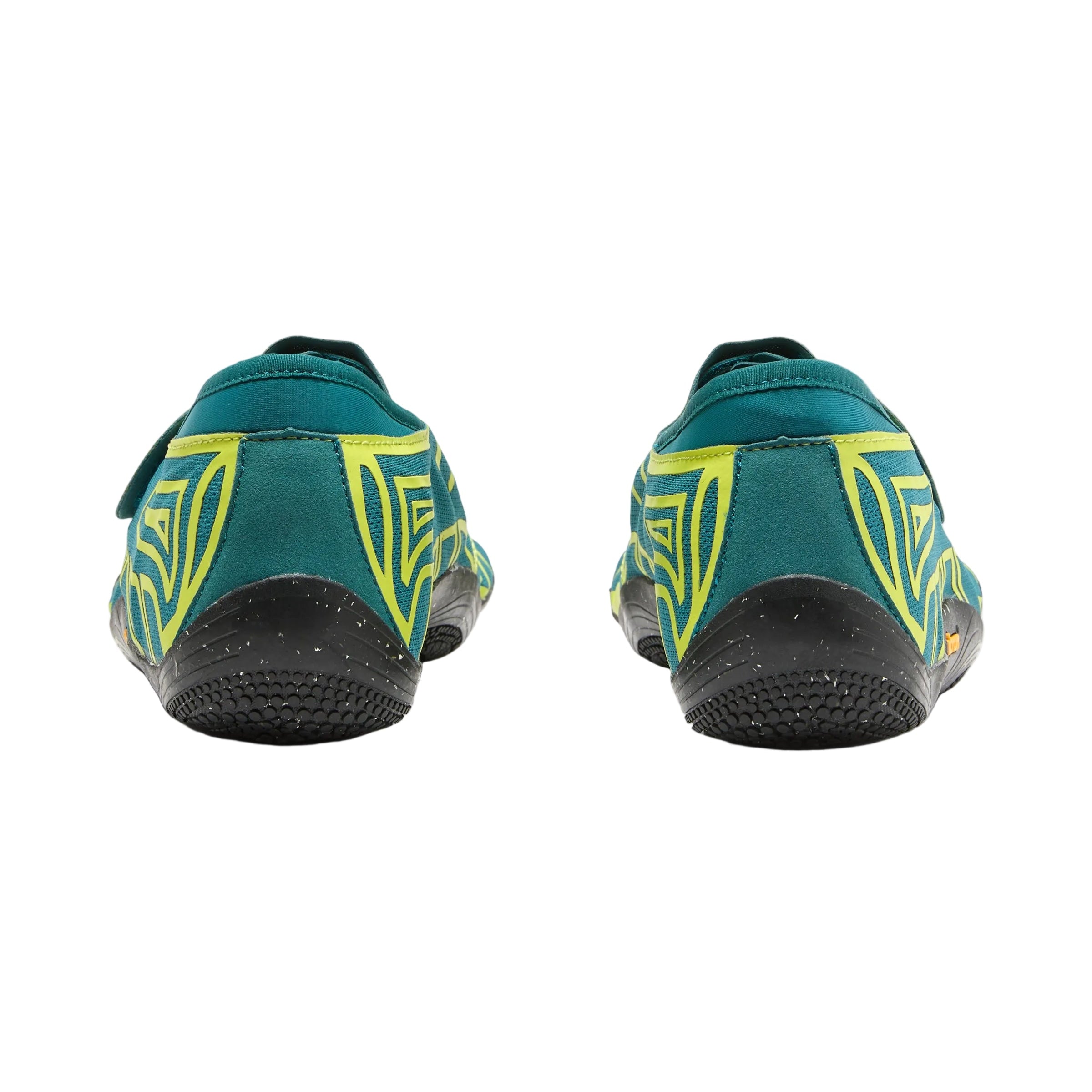 A pair of teal and neon yellow slip-on shoes shown from the back, featuring geometric yellow patterns on the sides and black soles, set against a plain white background.